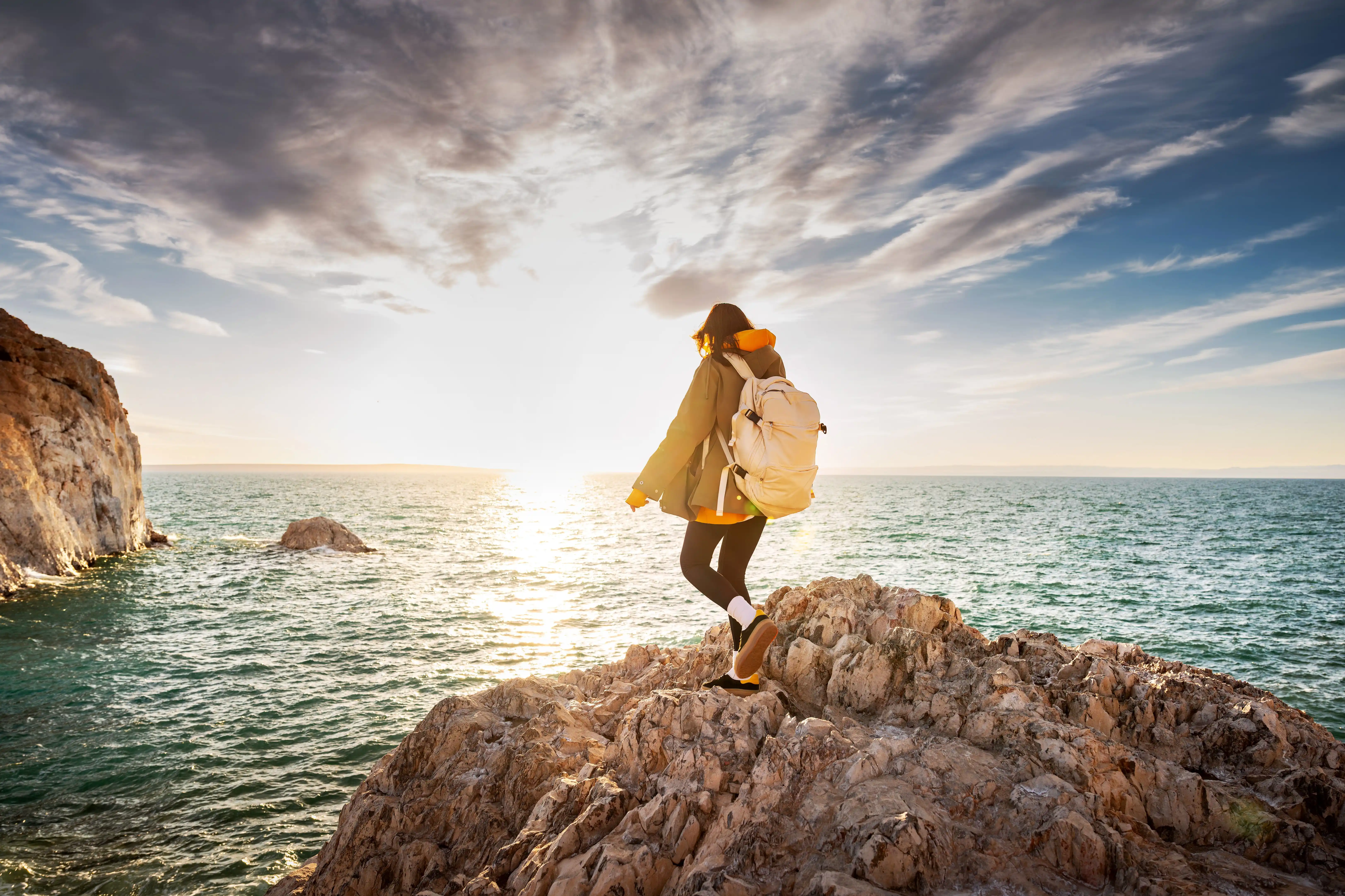 lady-standing-on-rocks-at-beach copy