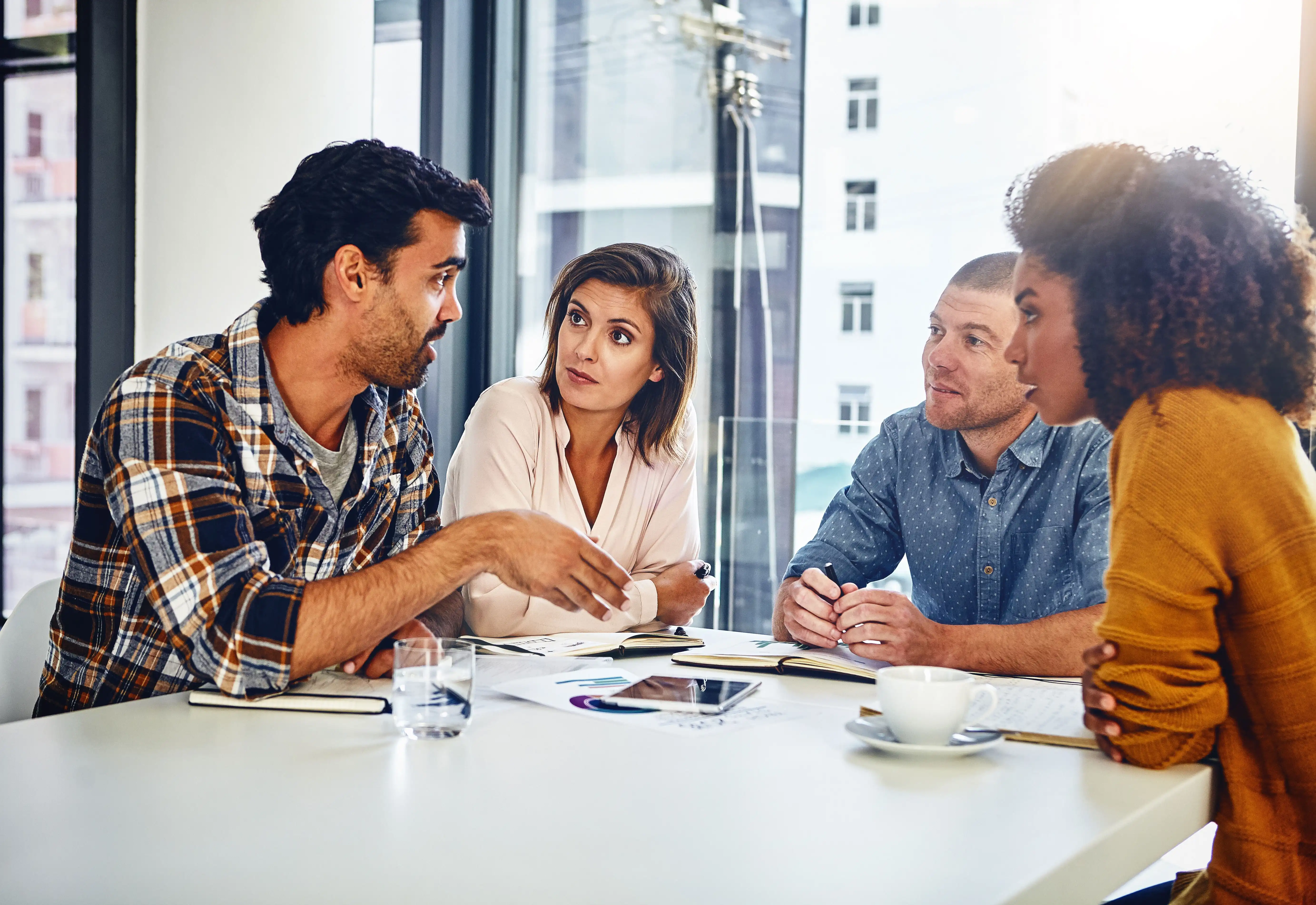 a team meeting in a UK financial office